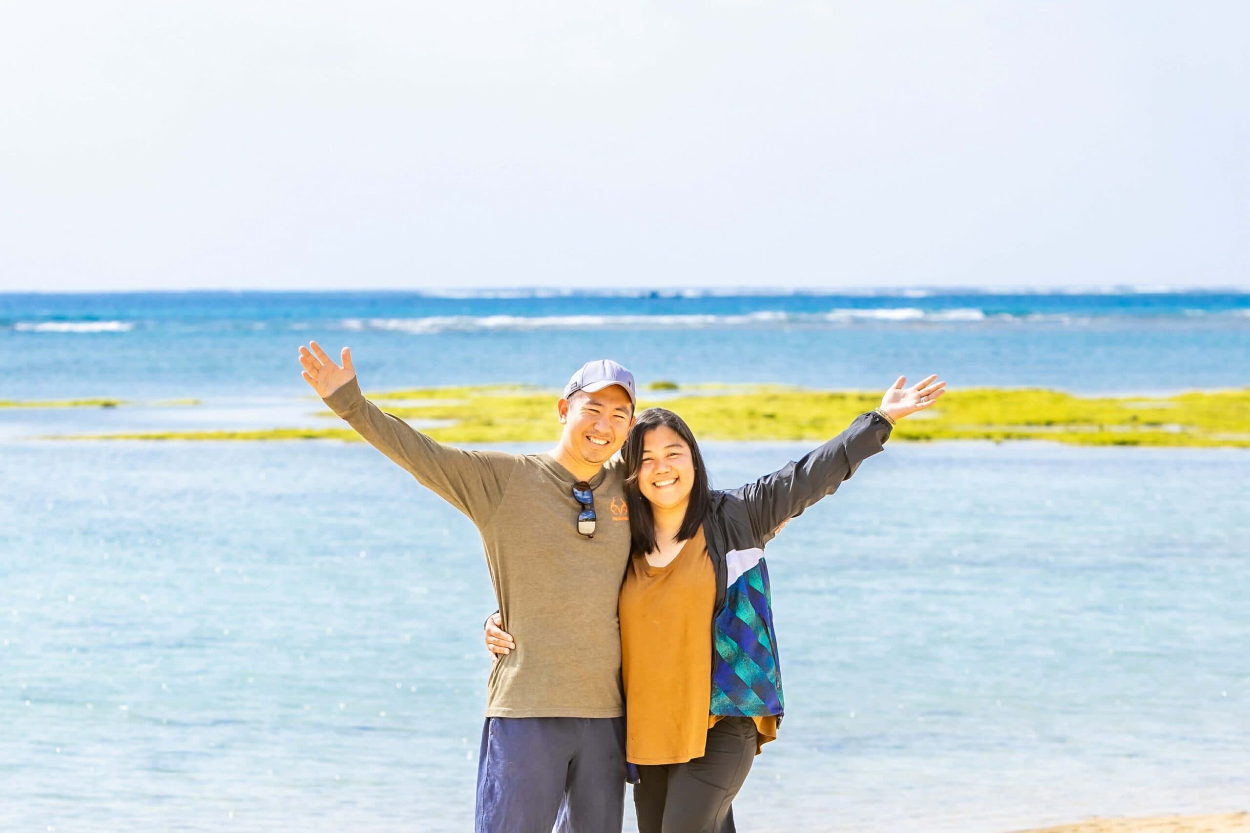 Zaira and KC, owners of ZE OKINAWA, on an Okinawa beach
